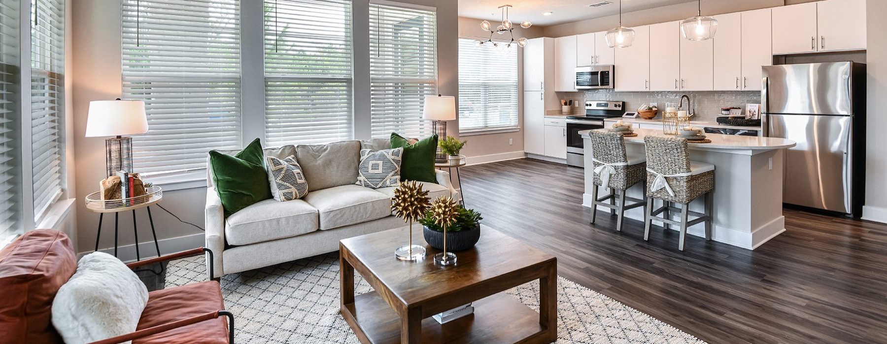 a living room with a couch, table and chairs