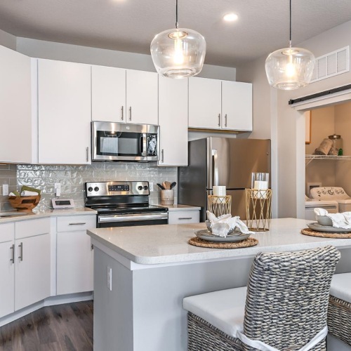 a kitchen with white cabinets
